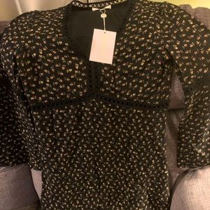 NWT Black floral print mini dress. Long sleeve and flowy cuffs.